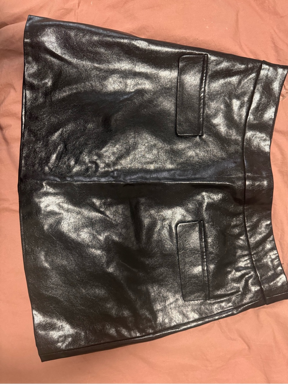 Meshki Black Faux Leather Mini Skirt with Front Pocket Flaps